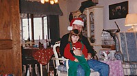 1995-12-25 02 Kelsey on Grandpa Steves lap in Gretna.jpg