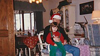 1995-12-25 12 Kelsey on Grandpa Steves lap.jpg