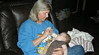 Grandma Debby feeding Byllea.jpg